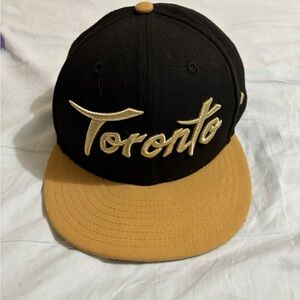 New Era Toronto Raptors Snapback Hat - Black and Gold